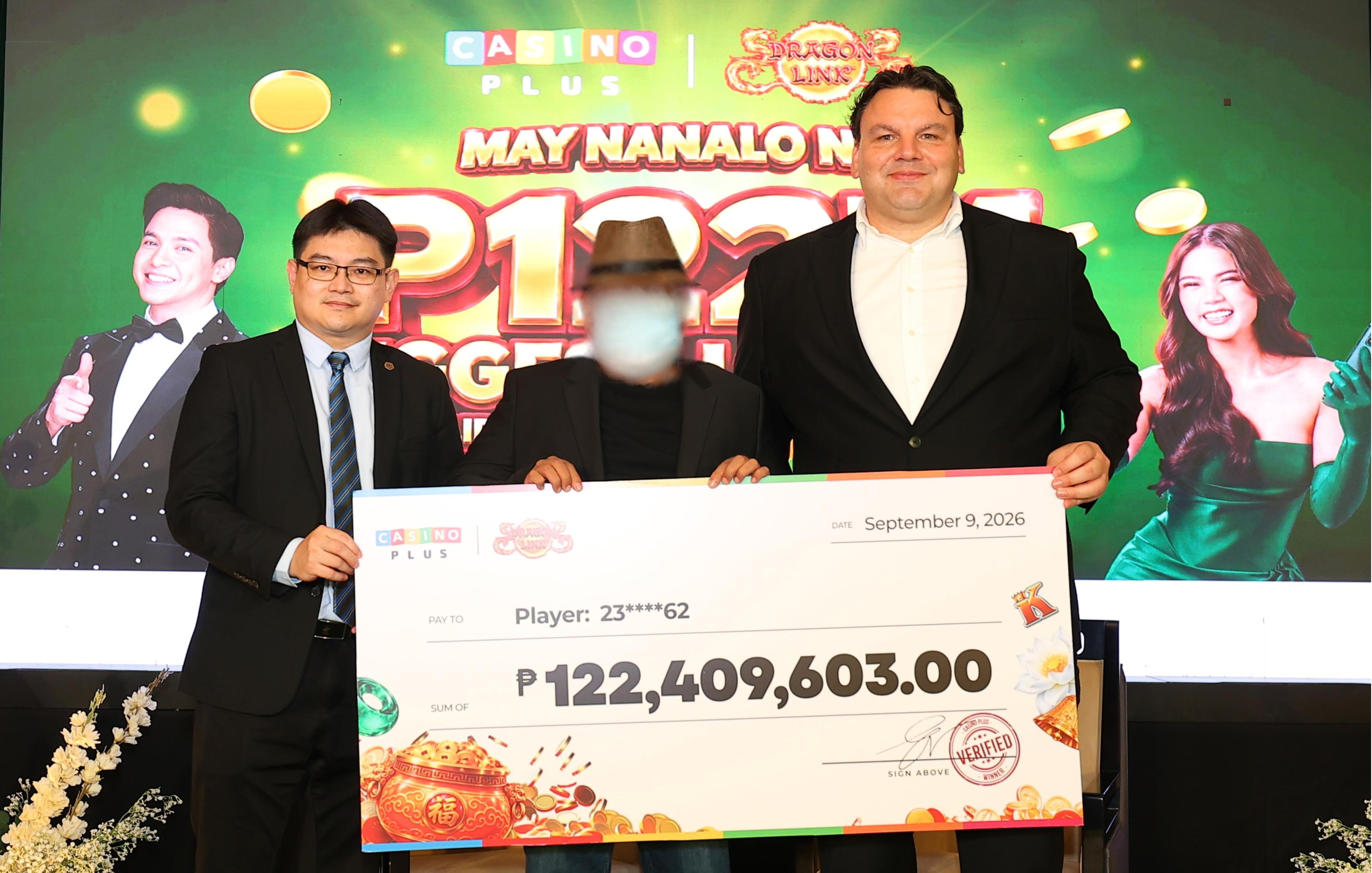 From left to right: LaVie Resorts and Casino Vice President for Slot Operations Stephen Tham, "Dragon King," the winnerof the P122.4 million jackpot, and Casino Plus CEO Evan Spytma during the ceremonial cheque turnover on September 9, 2026.